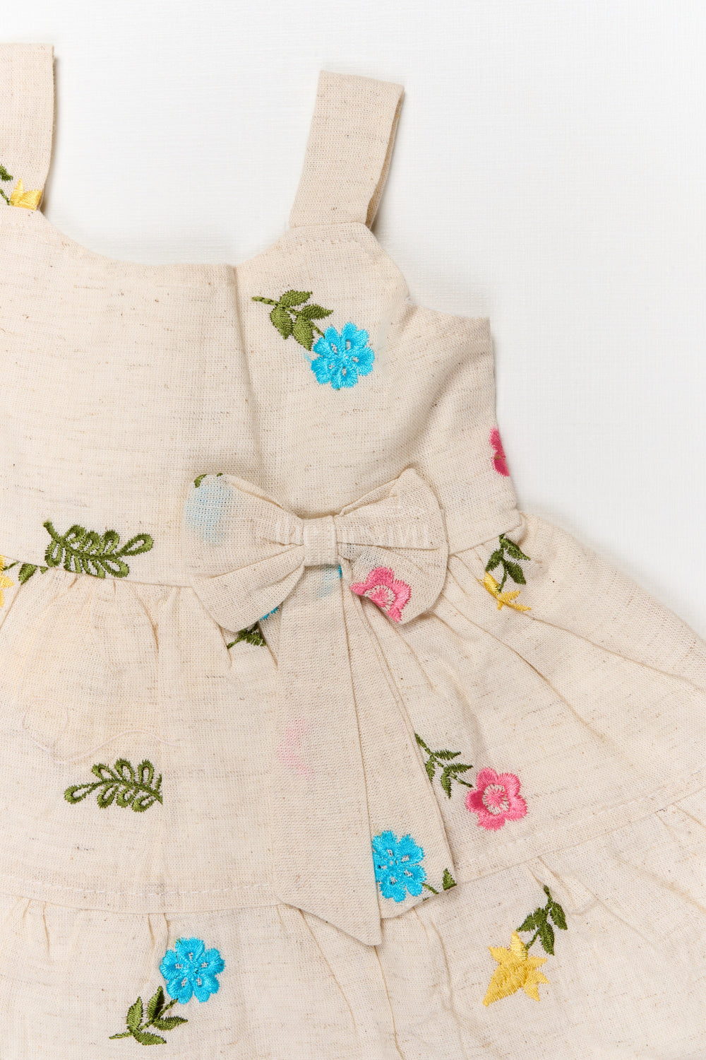 The Nesavu Baby Cotton Frocks Baby Girl Sleeveless Embroidered Cotton Frock for Everyday Comfort Nesavu Nesavu sleeveless cotton frock for baby girl with multicolor embroidery and bow detail