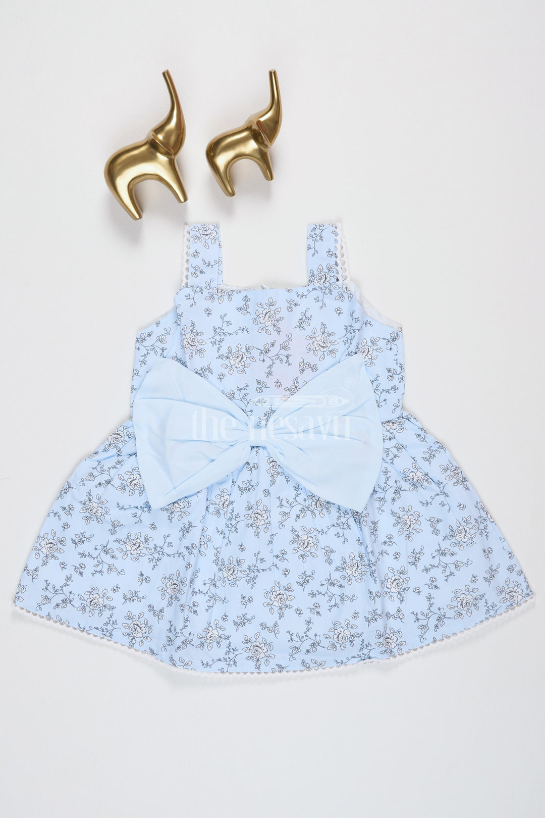 The Nesavu Baby Fancy Frock Baby Girls Blue Cotton Floral Frock with Large Bow and Lace Detailing for Casual Outings Nesavu 16 (1Y) / Blue BFJ640A-16 Nesavu Baby Girls Blue Cotton Frock Floral Print Bow Accent Lace Details Summer Parties