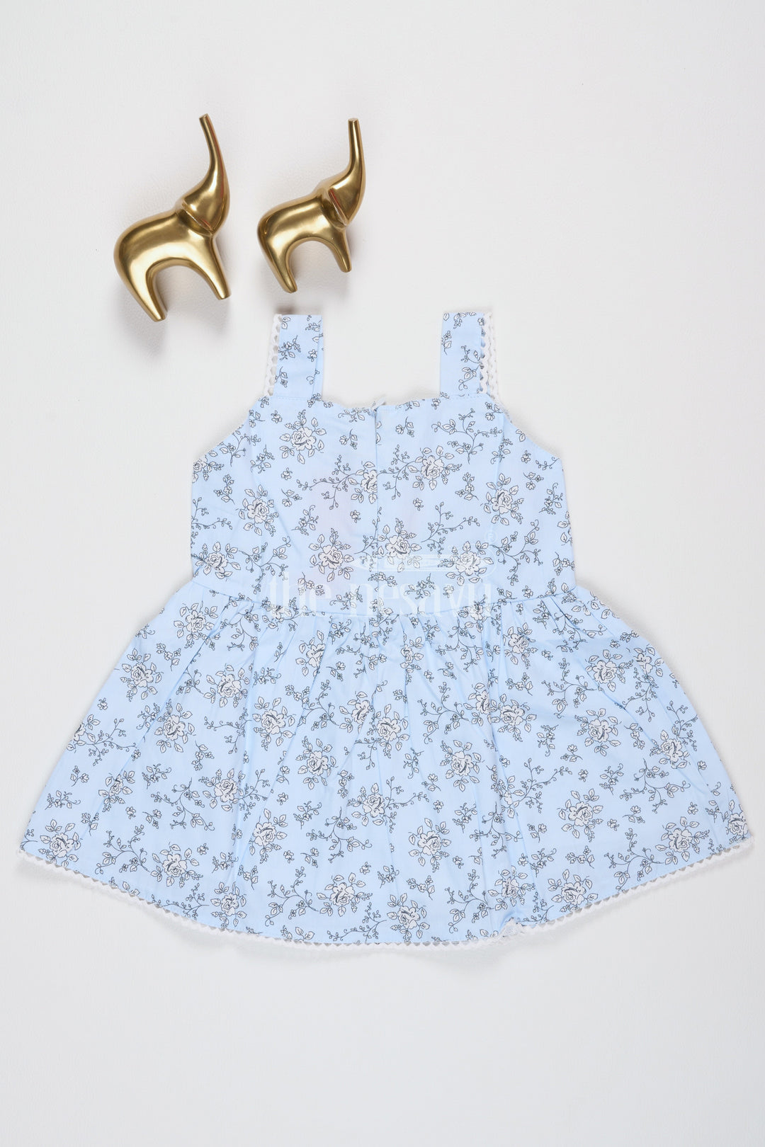 The Nesavu Baby Fancy Frock Baby Girls Blue Cotton Floral Frock with Large Bow and Lace Detailing for Casual Outings Nesavu Nesavu Baby Girls Blue Cotton Frock Floral Print Bow Accent Lace Details Summer Parties