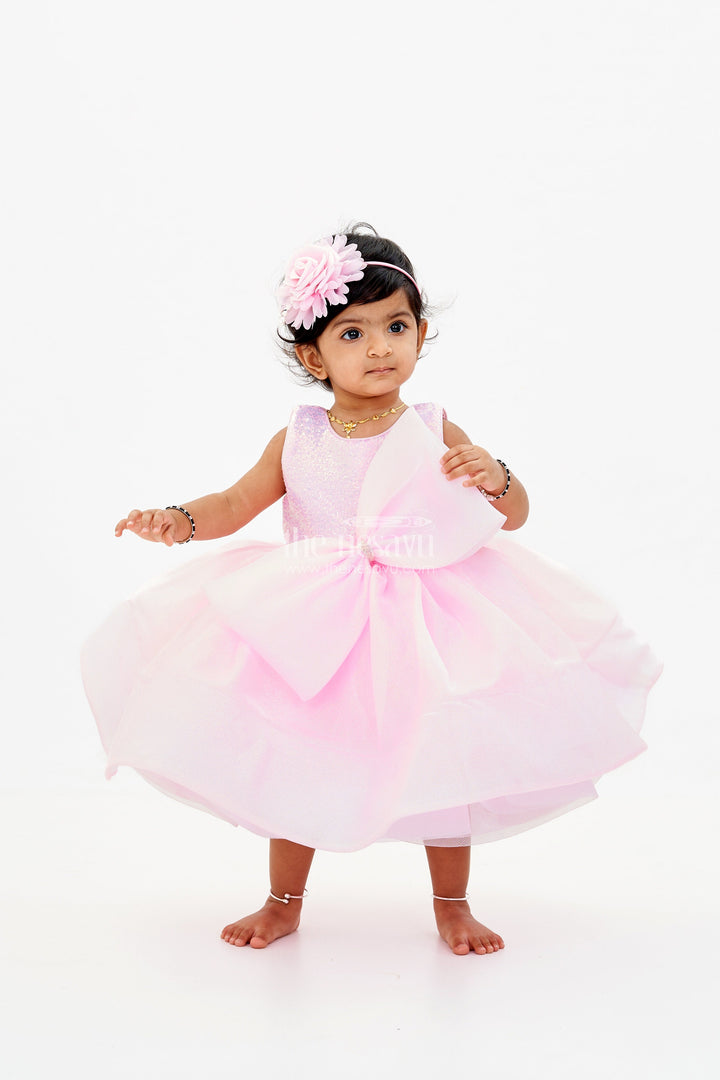 The Nesavu Baby Fancy Frock Baby Girls Fancy Frock in Pink Shimmer Fabric with Oversized Bow and Flared Silhouette Nesavu Baby Girls Fancy Frock Pink Shimmer Fabric Oversized Bow Flared Skirt | The Nesavu
