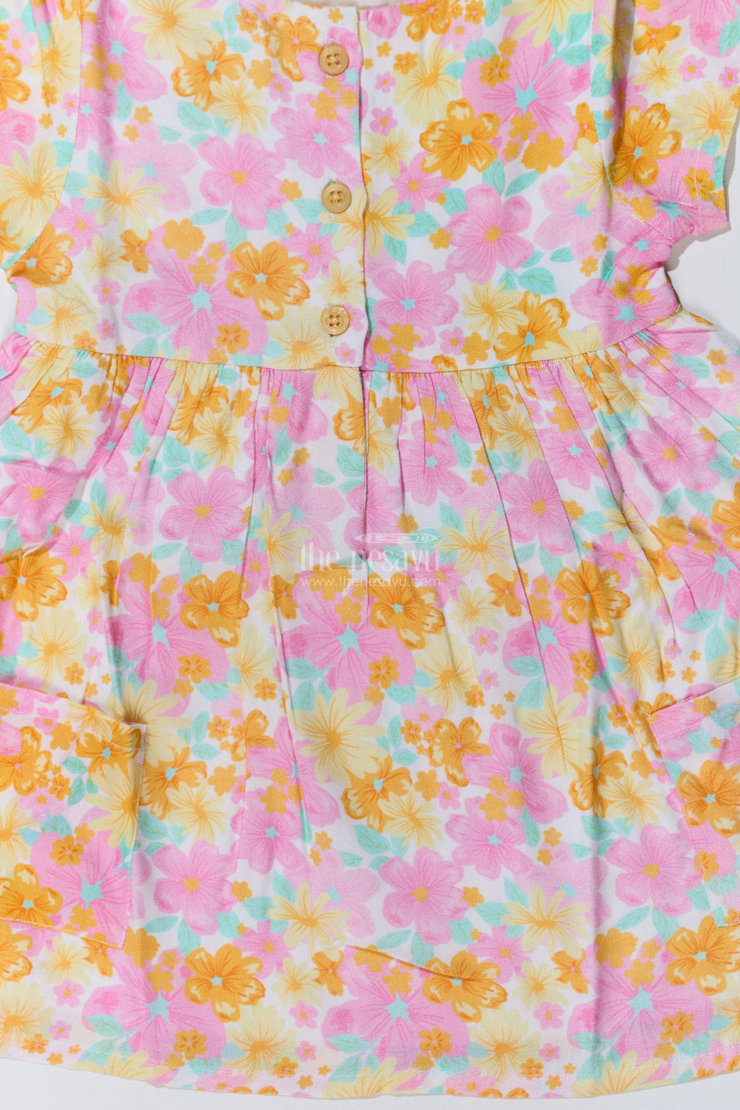 The Nesavu Baby Cotton Frocks Baby Girls Flower Print Frock with Button-Down Front and Side Pockets for a Cute Everyday Look Nesavu Baby Girls Flower Print Frock Button-Down Front Pockets a Cute Look | The Nesavu