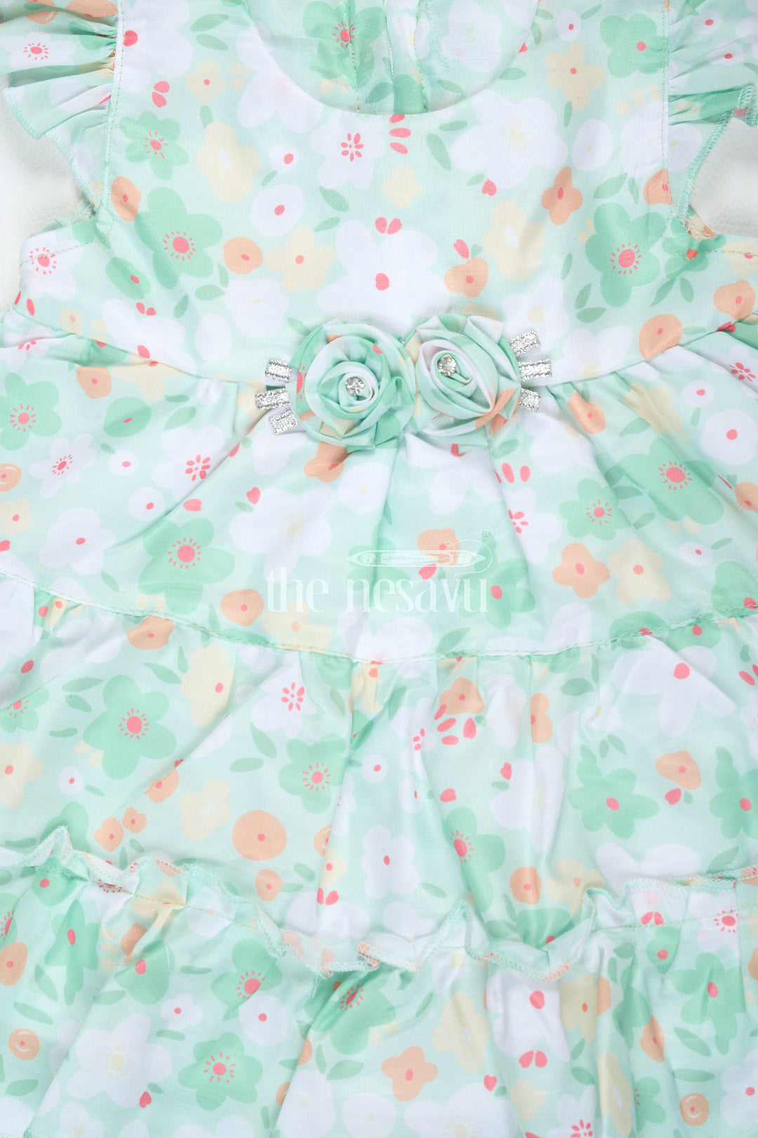 The Nesavu Baby Cotton Frocks Baby Girls Green Floral Frock with Ruffle Sleeves and Rosette Detail for Summer Outings Nesavu Nesavu Baby Girls Green Floral Frock Ruffle Sleeves Rosette Detail Summer Parties