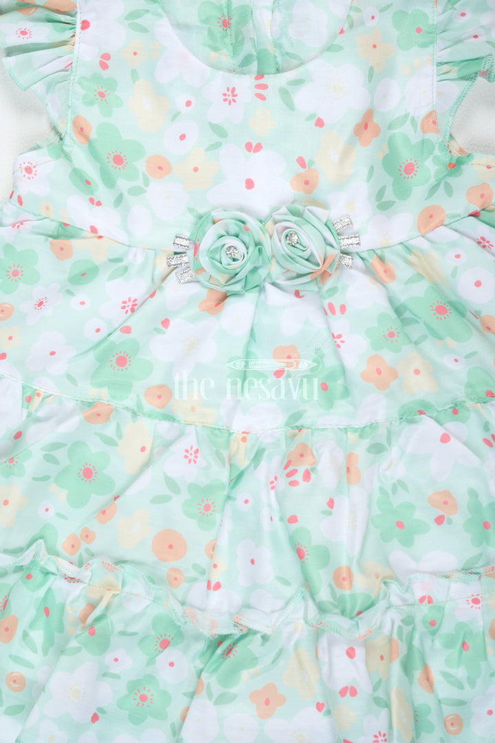 The Nesavu Baby Cotton Frocks Baby Girls Green Floral Frock with Ruffle Sleeves and Rosette Detail for Summer Outings Nesavu Nesavu Baby Girls Green Floral Frock Ruffle Sleeves Rosette Detail Summer Parties