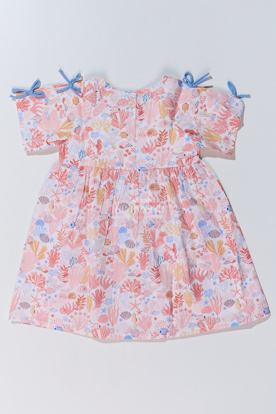 The Nesavu Baby Cotton Frocks Baby Girls Peach Frock with Ocean-Inspired Print and Tie-Up Sleeves for a Charming Look Nesavu Baby Girls Peach Frock Ocean Print Tie-Up Sleeves Playful Outfits | The Nesavu