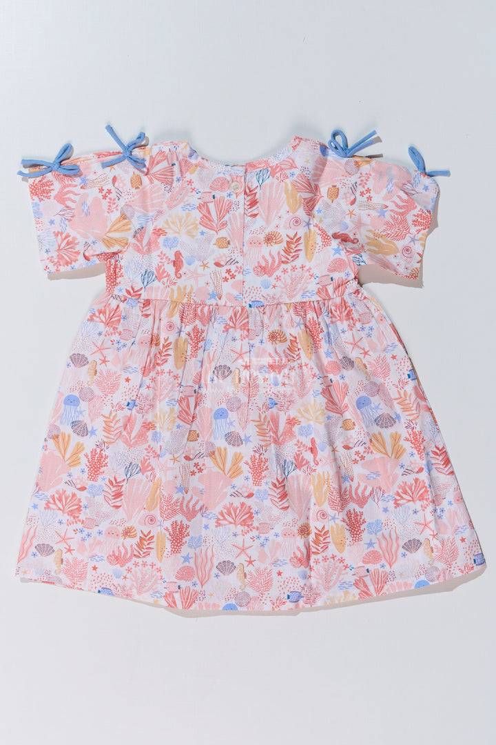 The Nesavu Baby Cotton Frocks Baby Girls Peach Frock with Ocean-Inspired Print and Tie-Up Sleeves for a Charming Look Nesavu Baby Girls Peach Frock Ocean Print Tie-Up Sleeves Playful Outfits | The Nesavu