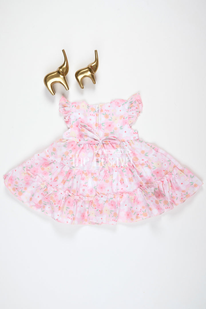 The Nesavu Baby Cotton Frocks Baby Girls Pink Floral Frock with Tiered Skirt and Bow Accent for Casual Outings Nesavu Nesavu Baby Girls Pink Floral Frock Tiered Skirt Bow Detail Playdates Birthday Parties