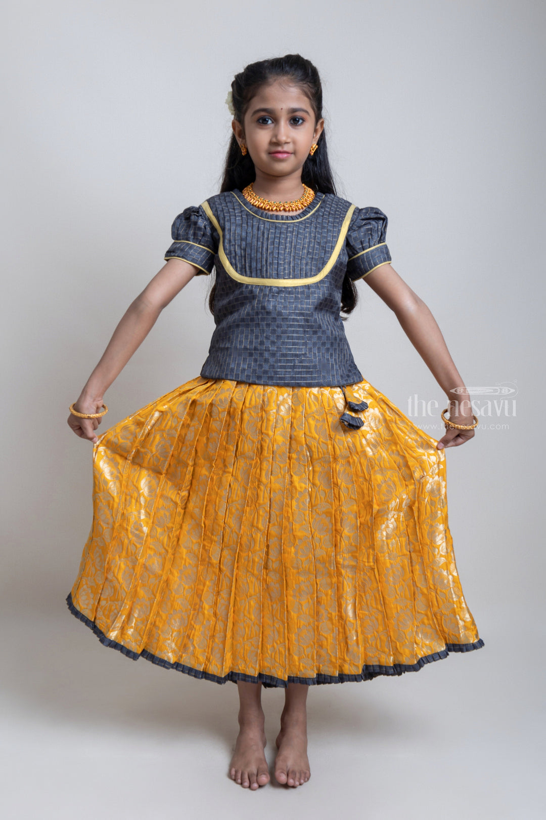 The Nesavu Pattu Pavadai Beautiful Traditional Brown Silk Blouse With Yellow Banarasi Jacquard Pleated Designer Pattu Pavadai For Girls Nesavu Silk Pavada For Girls | Premium Silk Frock Onine | The Nesavu