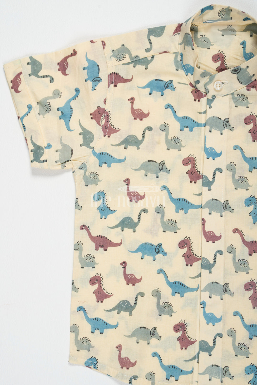 The Nesavu Boys Cotton Shirt Beige Boys Cotton Shirt with Dinosaur Print Half Sleeves Playful and Comfortable Fit Nesavu Beige Dinosaur Print Boys Cotton Shirt Nesavu Playful Half Sleeves Comfortable Casual Wear