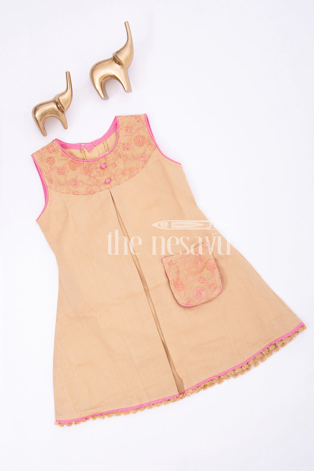 The Nesavu Baby Cotton Frocks Beige Designer Sleeveless Baby Frock with Embroidered Pocket Nesavu Beige Sleeveless Baby Frock with Embroidered Pocket