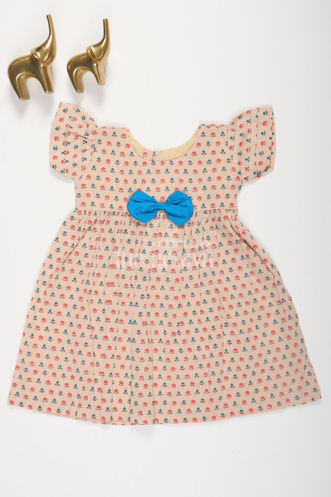 The Nesavu Baby Cotton Frocks Beige Floral Print Cotton Baby Frock for Girls with Blue Bow Accent Nesavu 10 (NB) / Beige BFJ562A-10 Beige Floral Print Cotton Baby Frock for Girls with Blue Bow Accent Nesavu