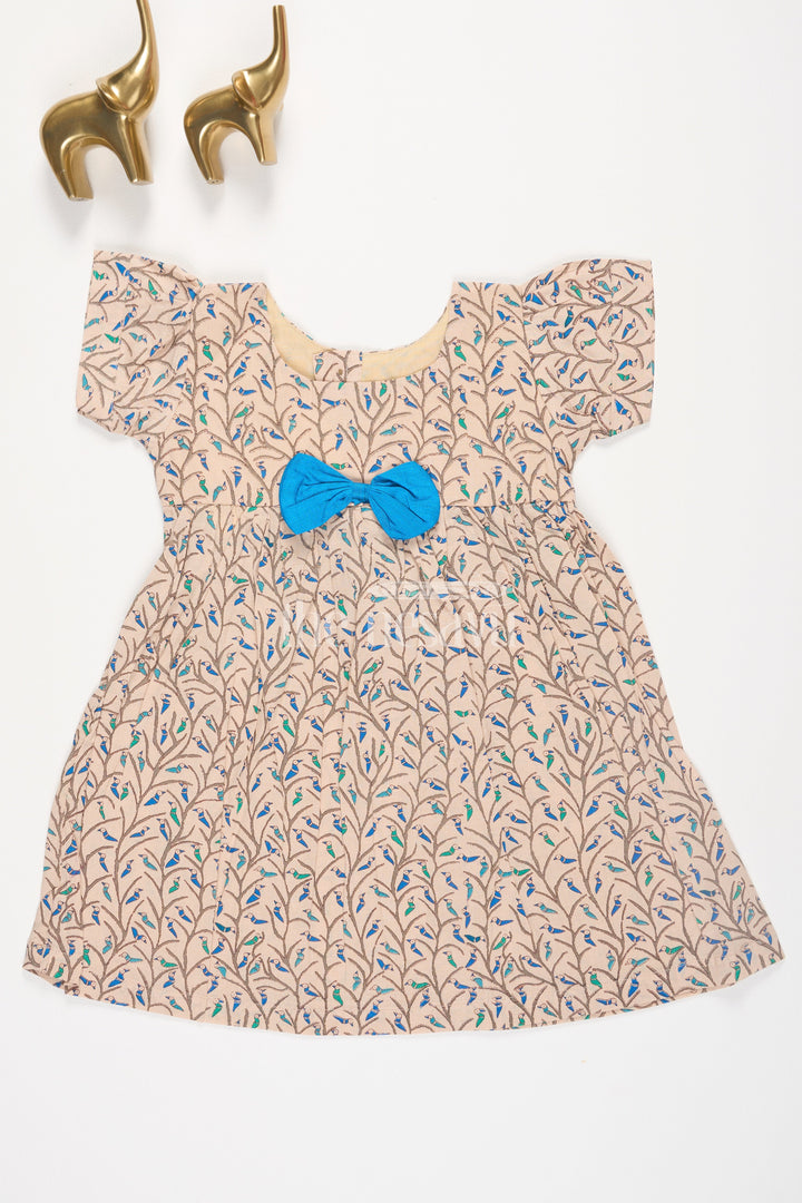 The Nesavu Baby Cotton Frocks Beige Floral Print Cotton Baby Frock for Girls with Blue Bow Accent Nesavu 10 (NB) / Beige BFJ562C-10 Beige Floral Print Cotton Baby Frock for Girls with Blue Bow Accent Nesavu