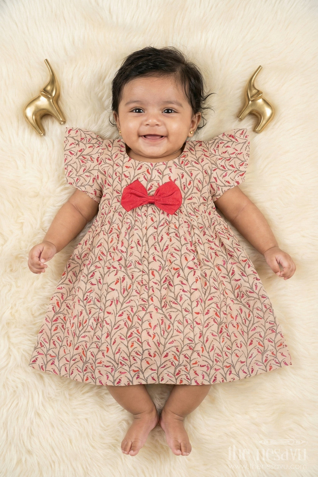 The Nesavu Baby Cotton Frocks Beige Floral Print Cotton Baby Frock for Girls with Red Bow Accent Nesavu 10 (NB) / Beige BFJ562D-10 Beige Floral Cotton Baby Frock with Red Bow