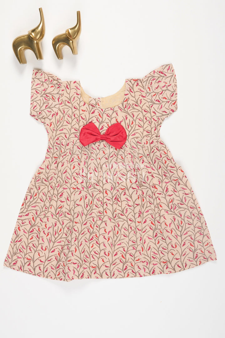 The Nesavu Baby Cotton Frocks Beige Floral Print Cotton Baby Frock for Girls with Red Bow Accent Nesavu 10 (NB) / Beige BFJ562D-10 Beige Floral Print Cotton Baby Frock for Girls with Red Bow Accent Nesavu