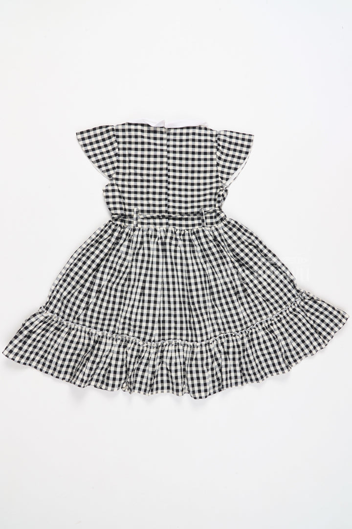 The Nesavu Girls Cotton Frock Black and White Chessboard Checked Cotton Frock with Peter Pan Collar for Girls Nesavu Black and White Chessboard Checked Cotton Frock with Peter Pan Collar for Girls Nesavu