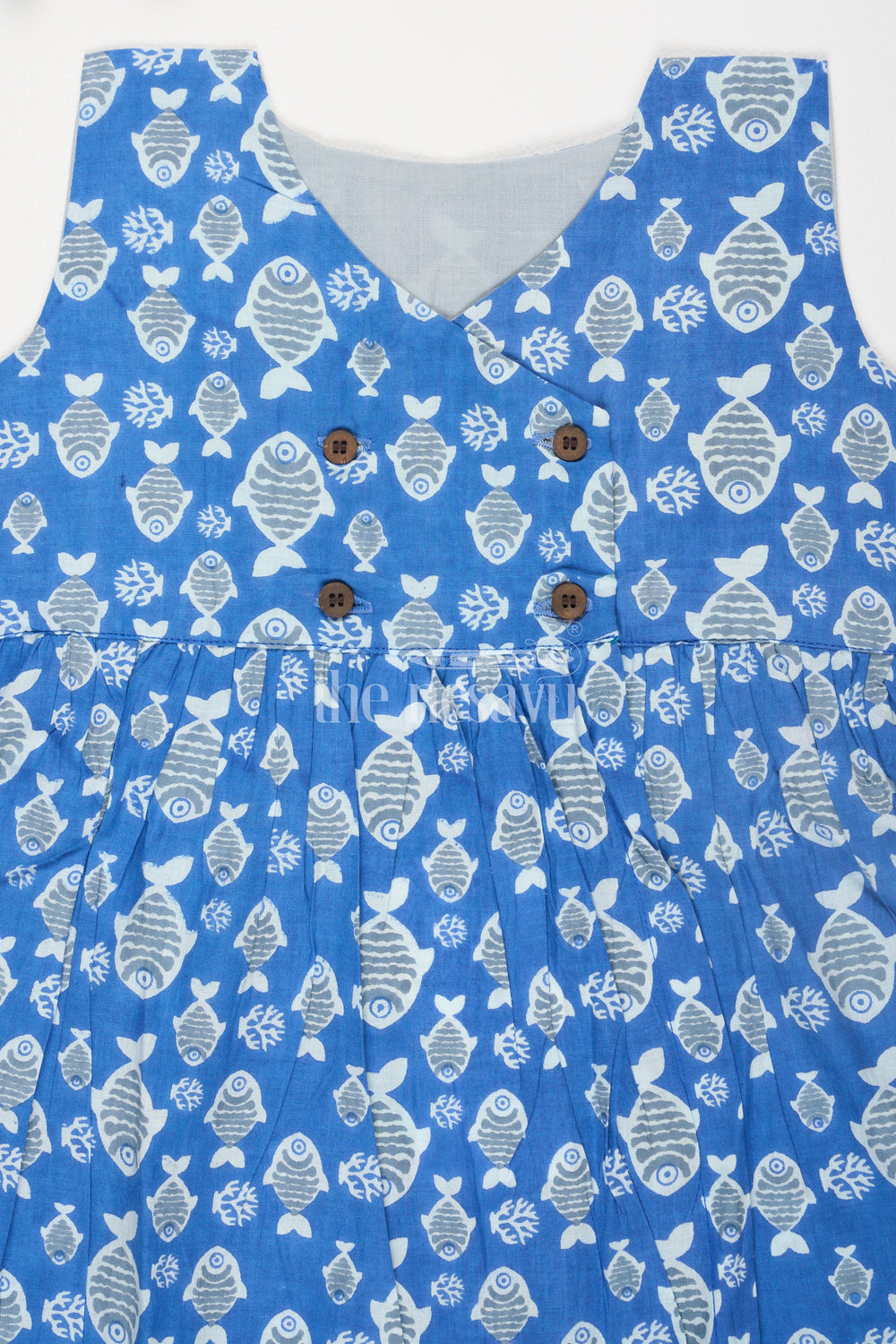 The Nesavu Baby Cotton Frocks Blue Fish Motif Baby Cotton Frock with Mockwrap Neckline and Button Detail Nesavu Blue Fish Motif Baby Cotton Frock with Mockwrap Neckline and Button Detail Nesavu