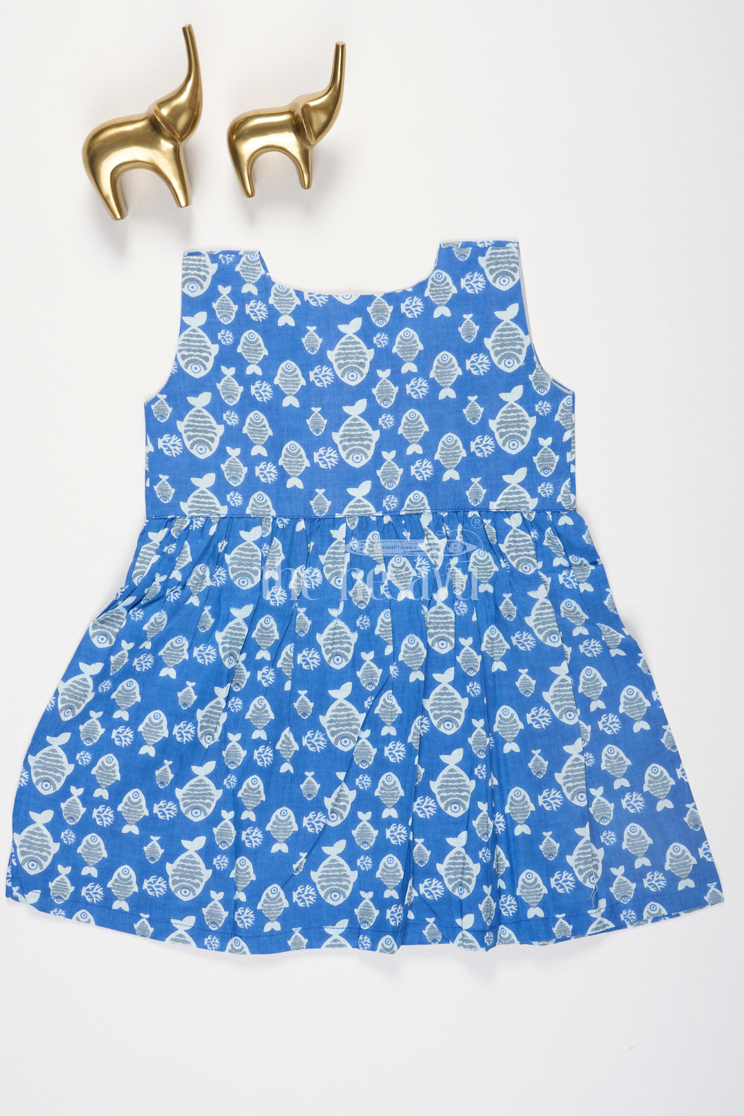 The Nesavu Baby Cotton Frocks Blue Fish Motif Baby Cotton Frock with Mockwrap Neckline and Button Detail Nesavu Blue Fish Motif Baby Cotton Frock with Mockwrap Neckline and Button Detail Nesavu