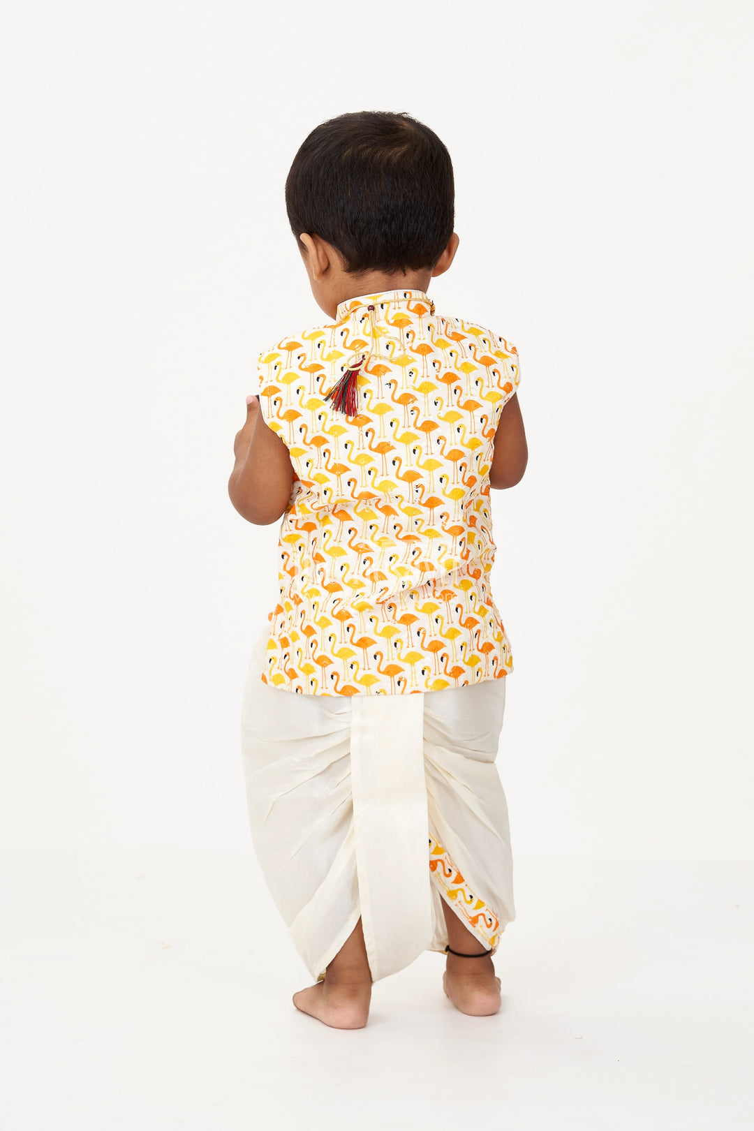The Nesavu Boys Dothi Set Boys Cotton Dhoti Pant Set with Yellow and Orange Flamingo Print Jacket in Cotton Blend Nesavu Boys Cotton Dhoti Pant Set Flamingo Printed Sleeveless Jacket Cream Bottom | The Nesavu