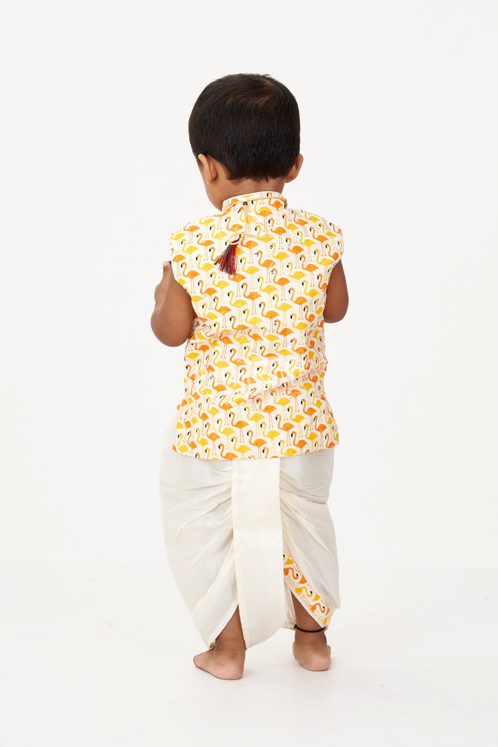 The Nesavu Boys Dothi Set Boys Cotton Dhoti Pant Set with Yellow and Orange Flamingo Print Jacket in Cotton Blend Nesavu Boys Cotton Dhoti Pant Set Flamingo Printed Sleeveless Jacket Cream Bottom | The Nesavu