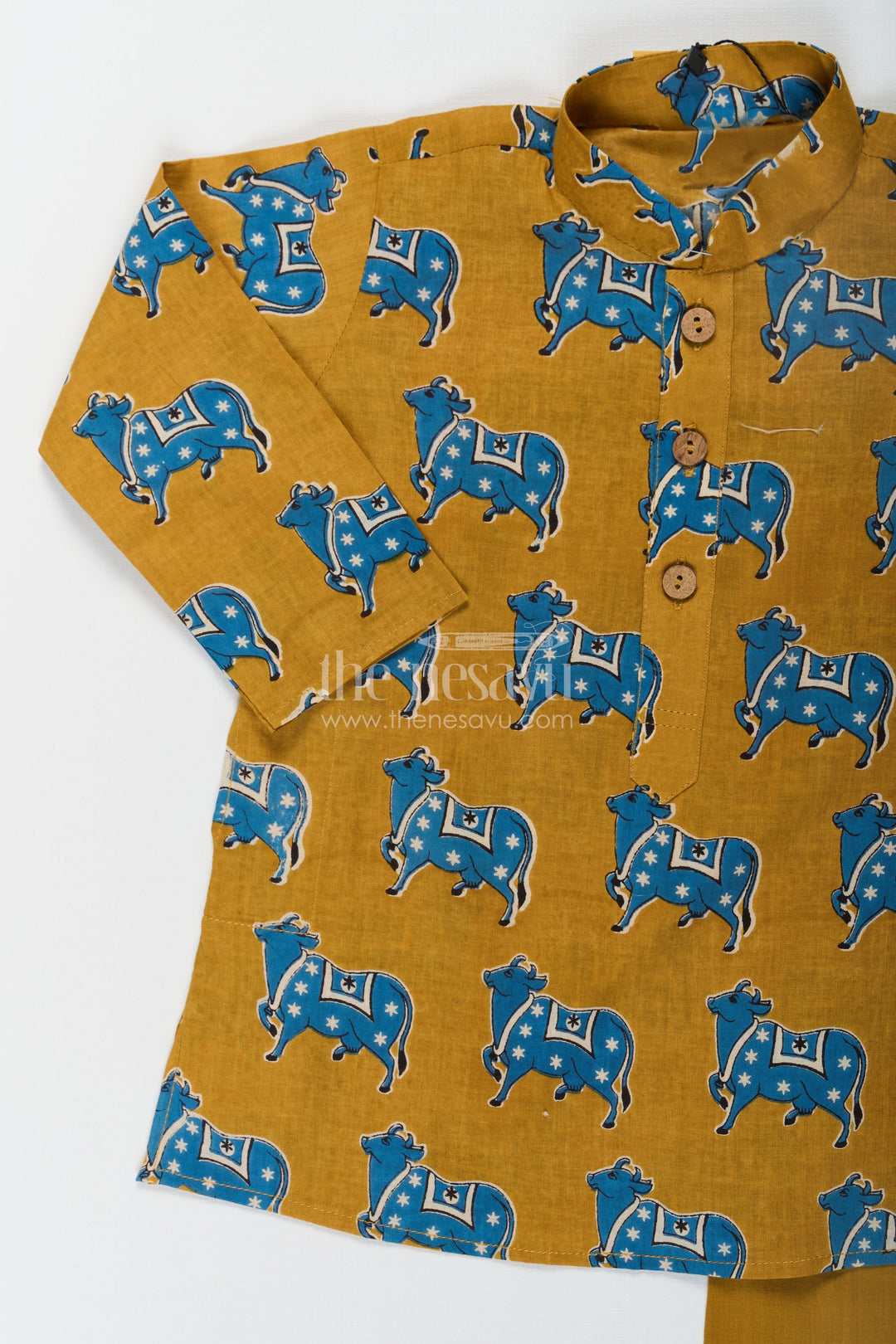 The Nesavu Boys Kurtha Set Boys Cotton Printed Kurta with Traditional Pichwai Motifs and Matching Pants in Mustard Nesavu Boys Cotton Printed Kurta Traditional Pichwai Motifs Matching Pants | The Nesavu