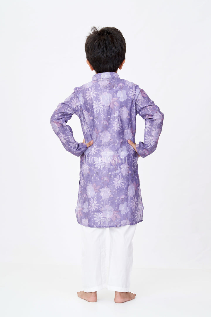 The Nesavu Boys Kurtha Set Boys Dark Purple Kurta Set in Silk Cotton with Self Embroidered Floral Digital Print and White Churidar Nesavu Boys Dark Purple Kurta Set Silk Cotton Floral Digital Embroidery White Churidar | The Nesavu