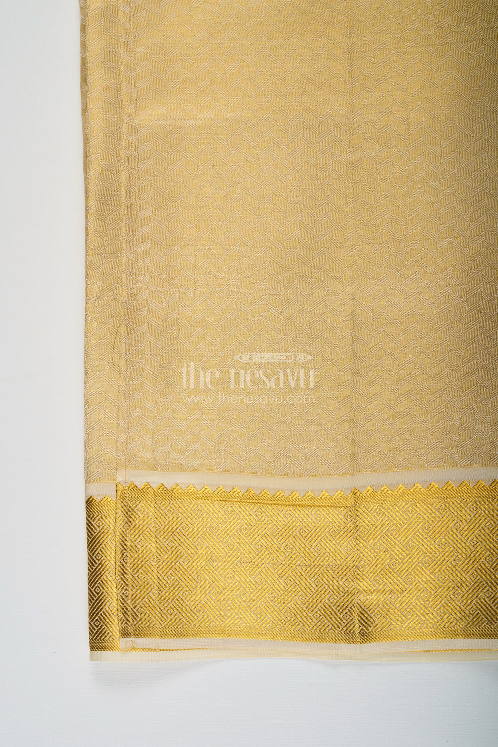 The Nesavu Boys Vesti Boys Golden Embossed Tissue Dhoti with Classic Patterned Border for Spiritual Wear in Dhoti for Puja Style Nesavu Boys Dhoti Puja Golden Embossed Tissue Traditional Zari Pattern Ritual Wear | The Nesavu