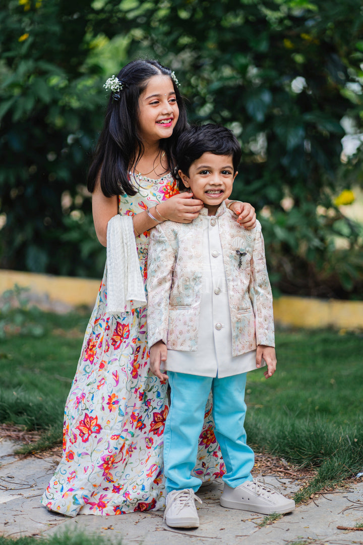 The Nesavu Boys Blazer Set Boys Sherwani Set with Pastel Floral Jacket and Blue Trousers for Weddings and Festivals Nesavu Nesavu Boys Sherwani Set Pastel Floral Jacket Blue Trousers Formal Occasions