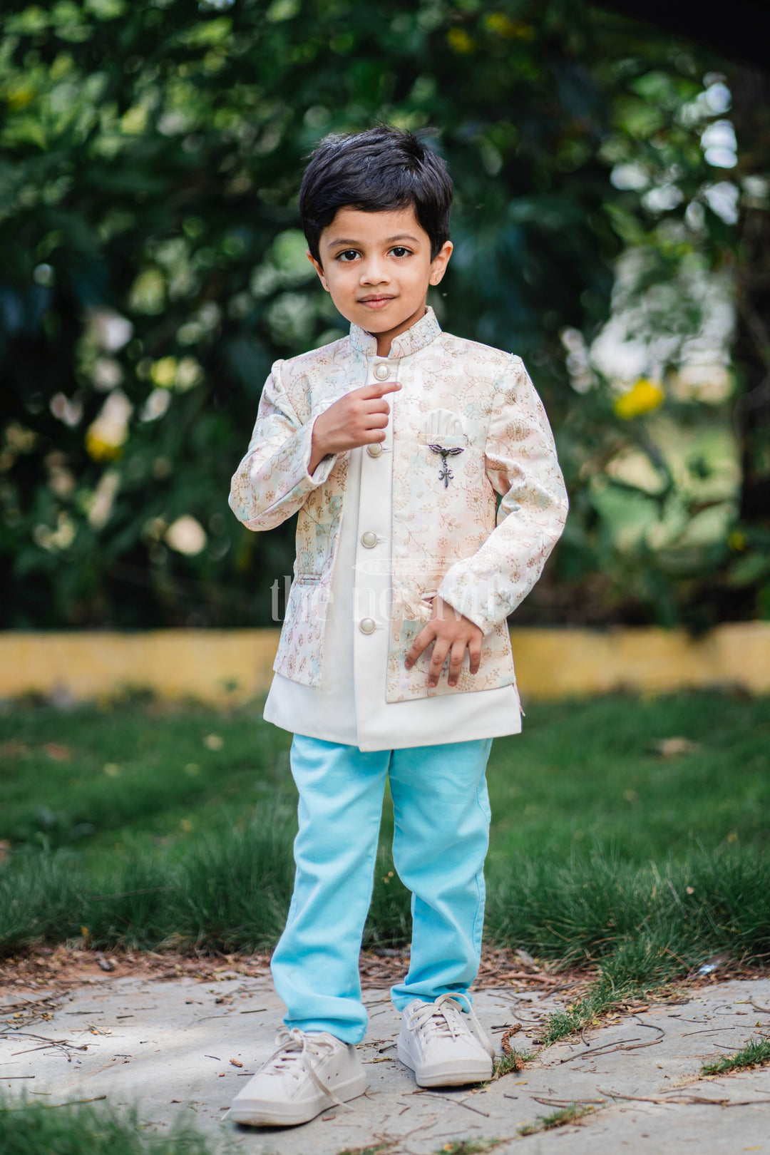 The Nesavu Boys Blazer Set Boys Sherwani Set with Pastel Floral Jacket and Blue Trousers for Weddings and Festivals Nesavu Nesavu Boys Sherwani Set Pastel Floral Jacket Blue Trousers Formal Occasions