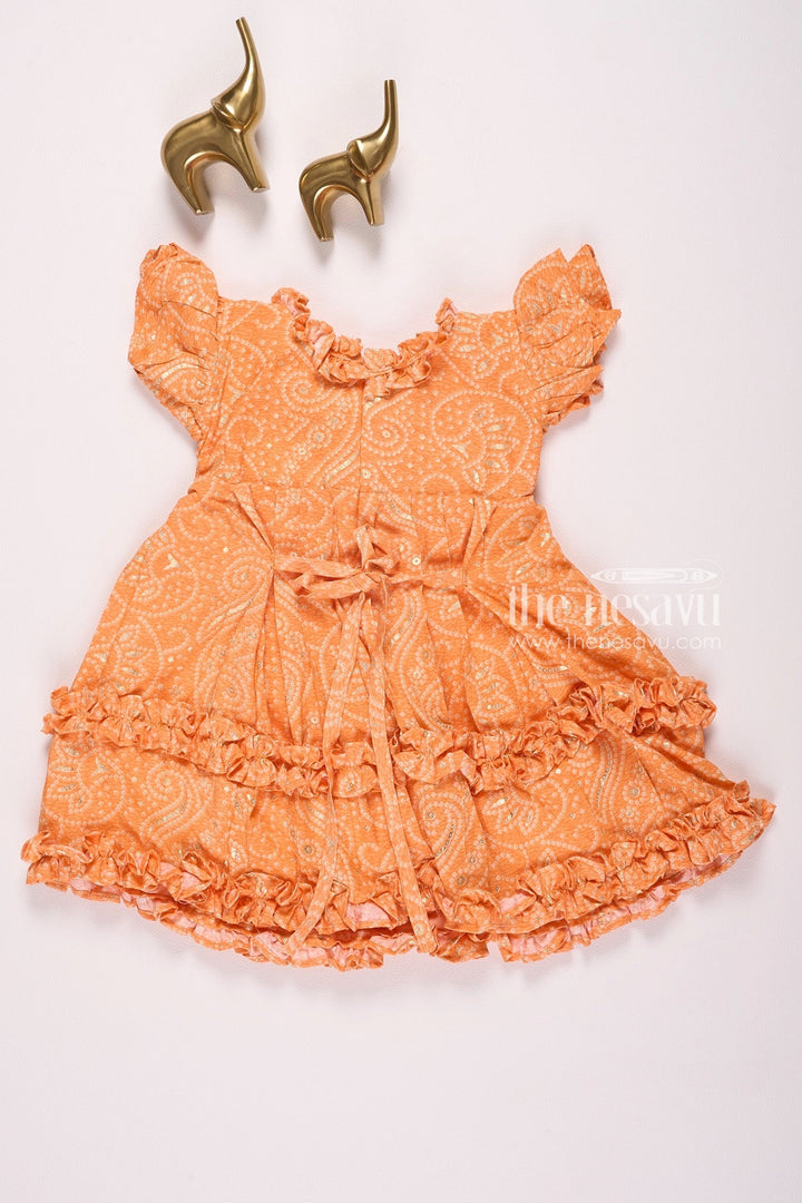 The Nesavu Girls Cotton Frock Bright Orange Ruffle Dress with Paisley Pattern for Girls Nesavu Bright Orange Ruffle Dress with Paisley Pattern for Girls - Vibrant & Stylish