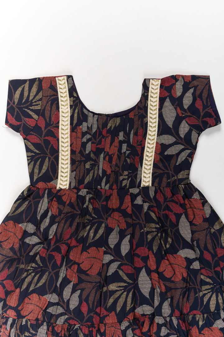 The Nesavu Girls Cotton Frock Charming Black Cotton Party Frock for Girls with Elegant Leaf Print and Frill Hem Nesavu Charming Black Cotton Party Frock Girls Elegant Leaf Print Frill Hem | The Nesavu