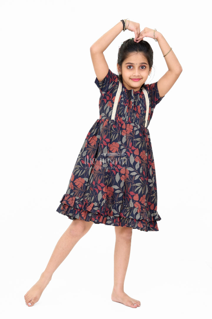 The Nesavu Girls Cotton Frock Charming Black Cotton Party Frock for Girls with Elegant Leaf Print and Frill Hem Nesavu Charming Black Cotton Party Frock Girls Elegant Leaf Print Frill Hem | The Nesavu