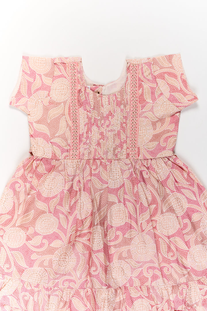 The Nesavu Girls Cotton Frock Charming Pink Cotton Girls Frock with Floral Patterns and Ruffled Sleeves for Everyday Wear Nesavu Charming Pink Cotton Girls Frock Floral Patterns Ruffled Sleeves Everyday Wear | The Nesavu