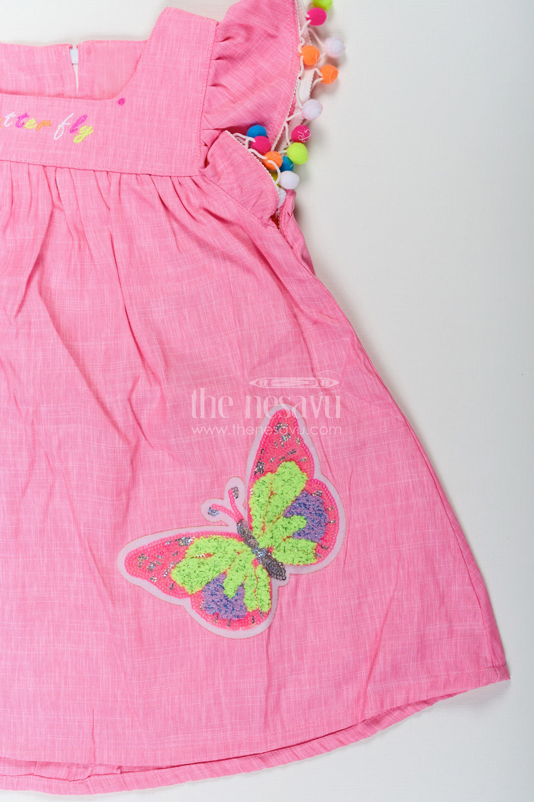 The Nesavu Baby Cotton Frocks Chhote Bacchon Ke Liye Frock in Pink Cotton Blend with Pom Poms and Butterfly Patch Embroidery Nesavu Pink Frock Chhote Bacchon Pom Pom Sleeves Sequin Butterfly Patch | The Nesavu
