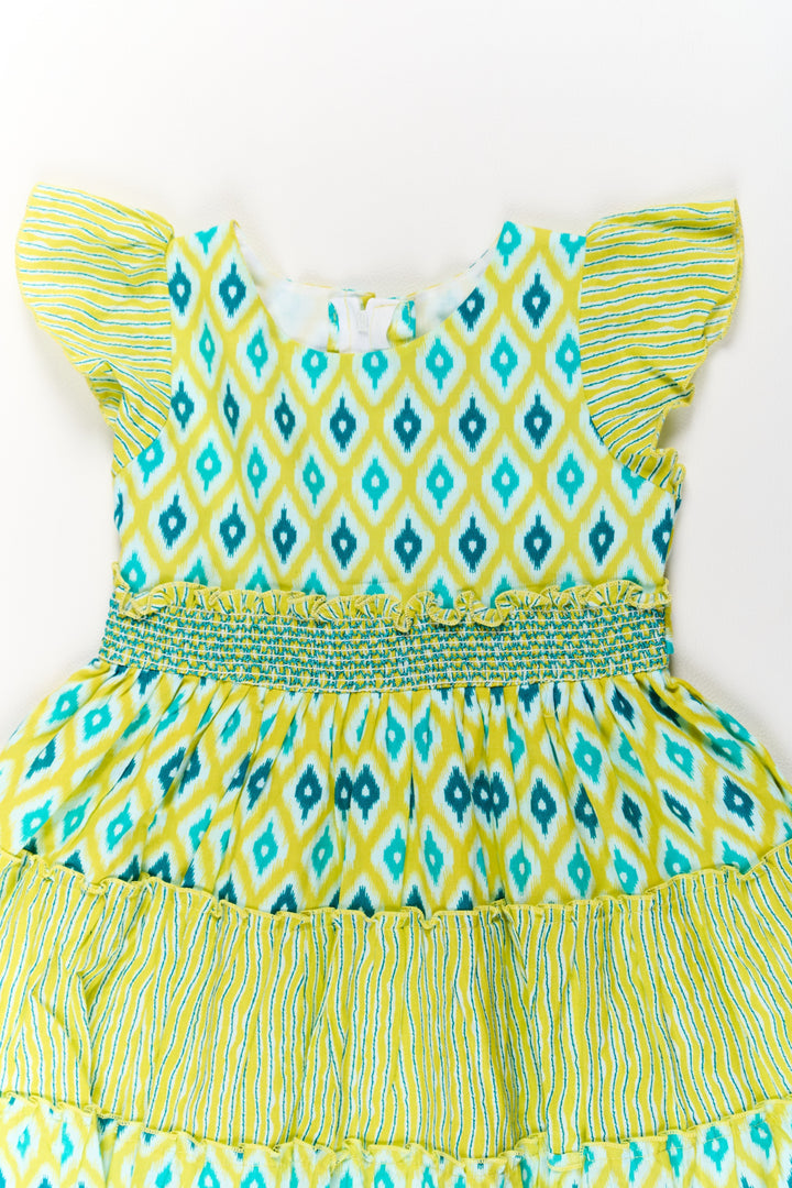 The Nesavu Girls Cotton Frock Cotton Dresses for Girls with Ikat Print and Ruffled Cap Sleeves Nesavu Cotton Dresses Girls Ikat Print Smocked Bodice Ruffled Sleeves | The Nesavu