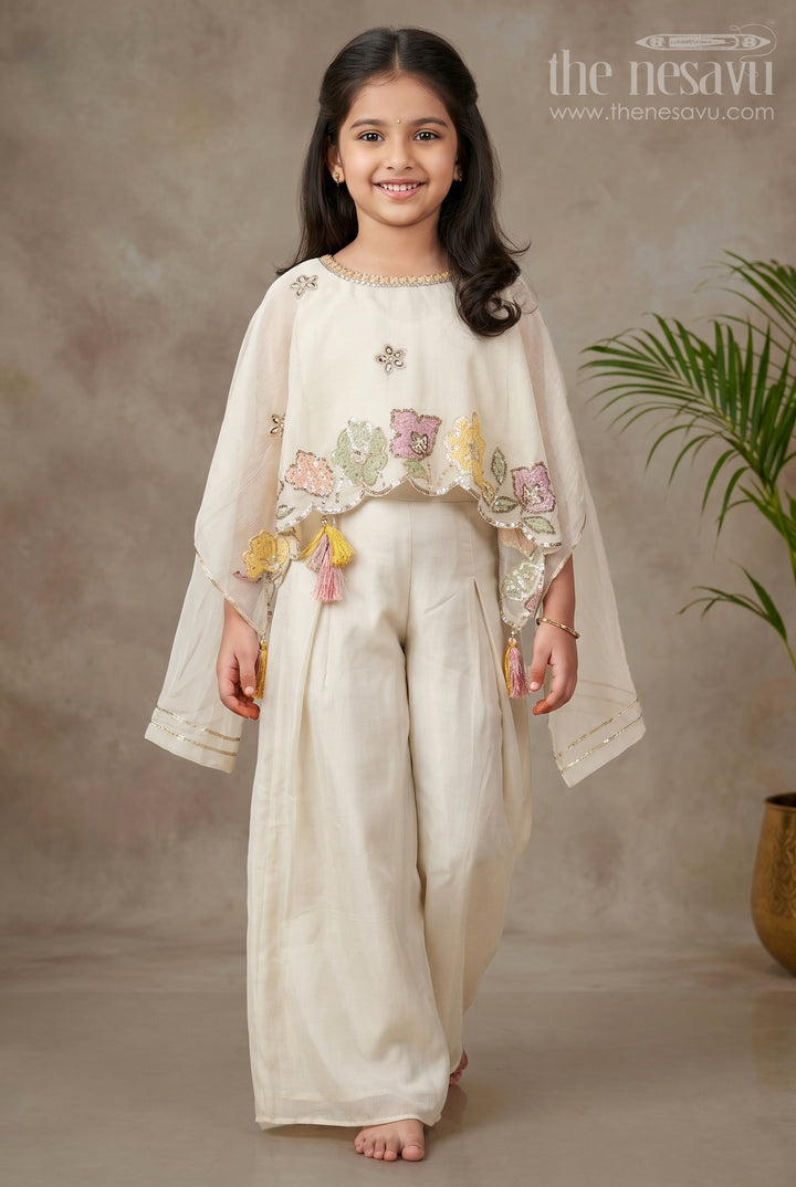 The Nesavu Girls Sharara / Plazo Set Cream Color Sharara Set for Girls in Shimmer Viscose Silk with Designer Embroidered Cape and Tassels Nesavu 16 (1Y) / Cream GPS599A-16 Girls Cream Color Sharara Set Embroidered Shimmer Cape Top Flared Silk Pants | The Nesavu
