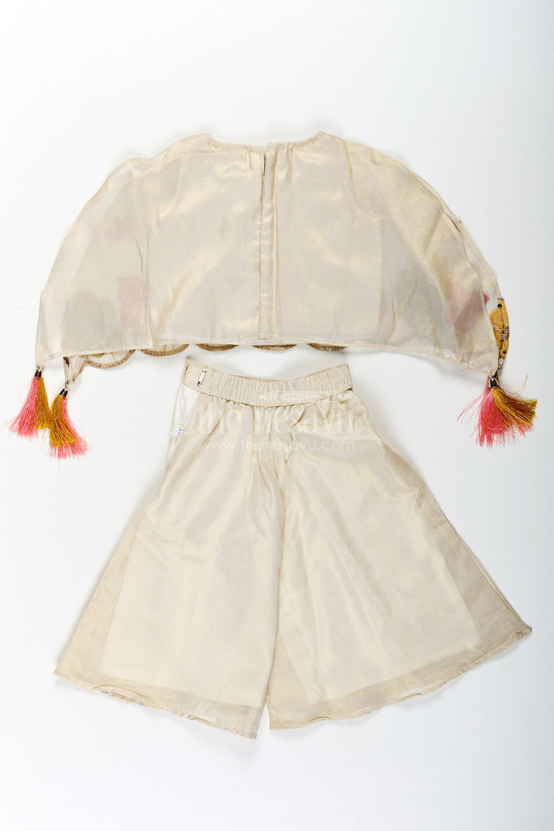 The Nesavu Girls Sharara / Plazo Set Cream Color Sharara Set for Girls in Shimmer Viscose Silk with Designer Embroidered Cape and Tassels Nesavu Girls Cream Color Sharara Set Embroidered Shimmer Cape Top Flared Silk Pants | The Nesavu