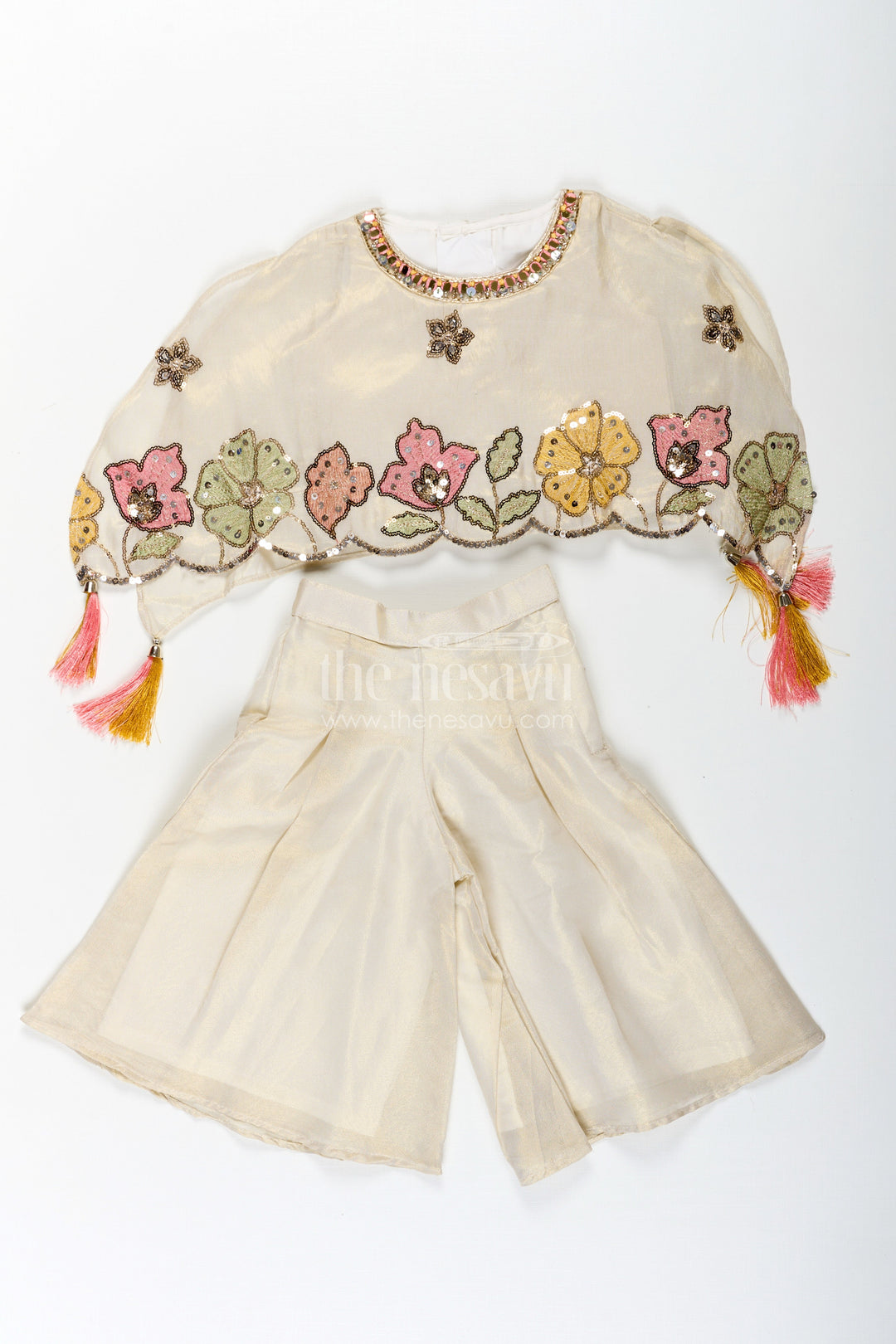 The Nesavu Girls Sharara / Plazo Set Cream Color Sharara Set for Girls in Shimmer Viscose Silk with Designer Embroidered Cape and Tassels Nesavu Girls Cream Color Sharara Set Embroidered Shimmer Cape Top Flared Silk Pants | The Nesavu