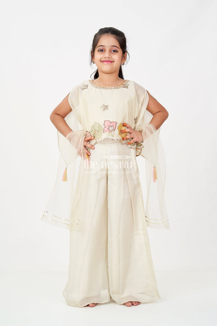 The Nesavu Girls Sharara / Plazo Set Cream Color Sharara Set for Girls in Shimmer Viscose Silk with Designer Embroidered Cape and Tassels Nesavu Girls Cream Color Sharara Set Embroidered Shimmer Cape Top Flared Silk Pants | The Nesavu