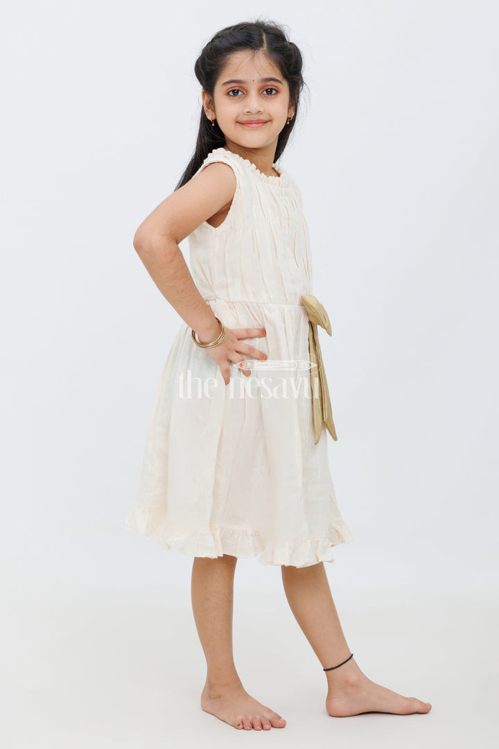 The Nesavu Girls Cotton Frock Cream Cotton Frock with Lurex Zeri Stripes and Antique Golden Bow for Girls Nesavu Cream Cotton Frock with Lurex Zeri Stripes and Antique Golden Bow for Girls Nesavu