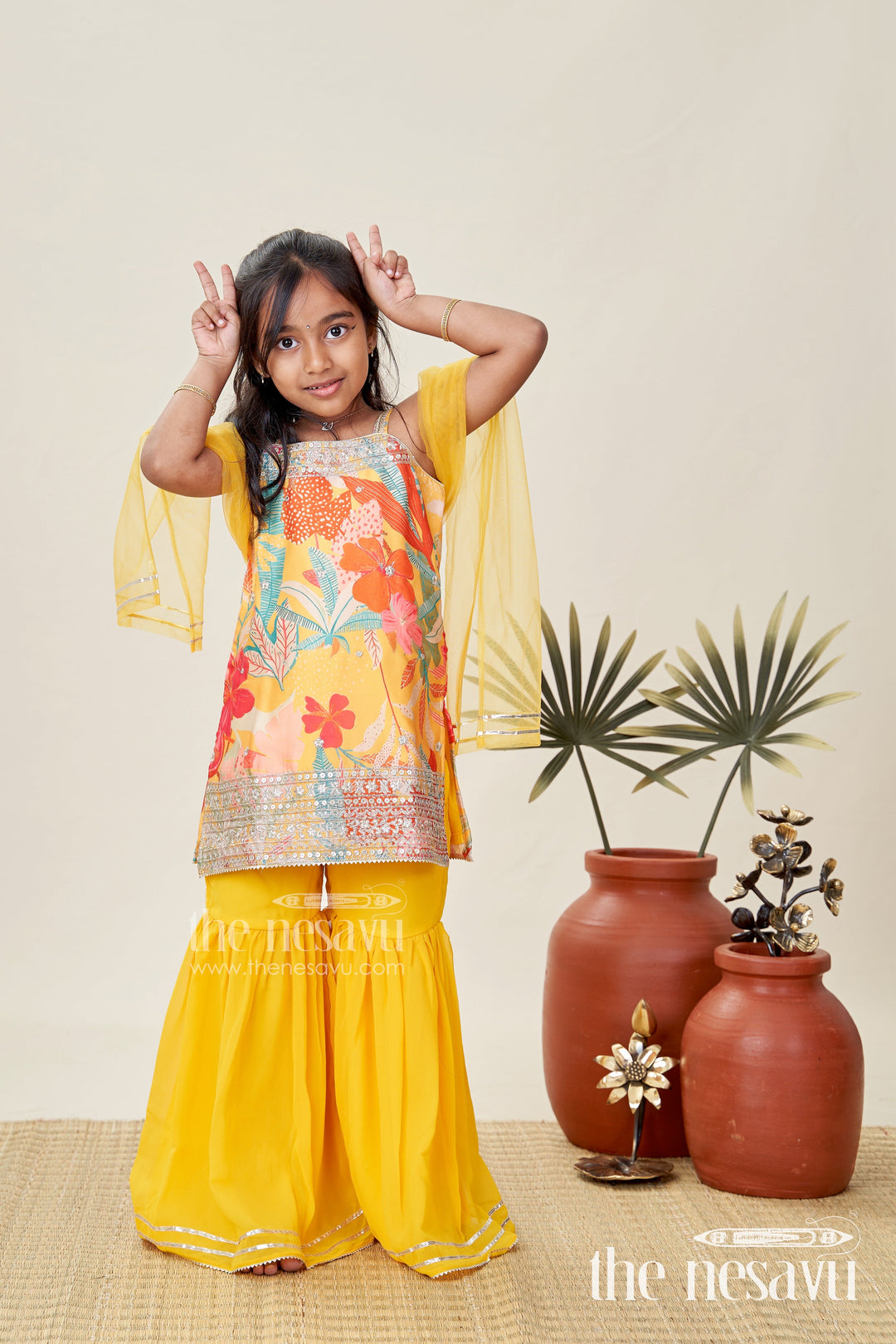 The Nesavu Girls Sharara / Plazo Set Designer Sharara Suit for Girls Traditional Occasion Set Nesavu 16 (1Y) / Yellow GPS536B-16 Nesavu Girls Yellow Designer Sharara Suit Floral Print Top Ruffle Bottom Chinon Fabric