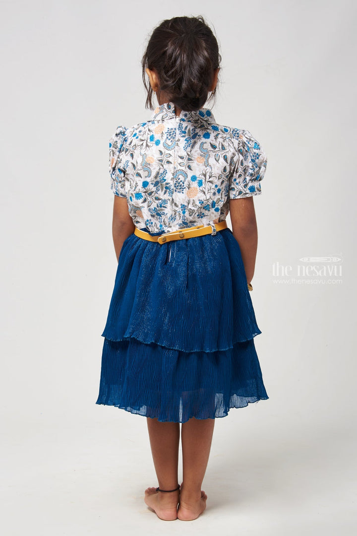 The Nesavu Frocks & Dresses Double Layer Flared Blue Frock - Floral Tie Neck Design Nesavu Floral Printed Fancy Frock | Latest Frocks for Girls | The Nesavu Elevate your childs wardrobe with our Floral Printed Tie Neck with Double Layer Flared Blue Frock. The floral print adds elegance, while the sleeveless design ensures comfort. The tie neck detail adds a stylish touch, and the double layer flared skirt creates a graceful look.