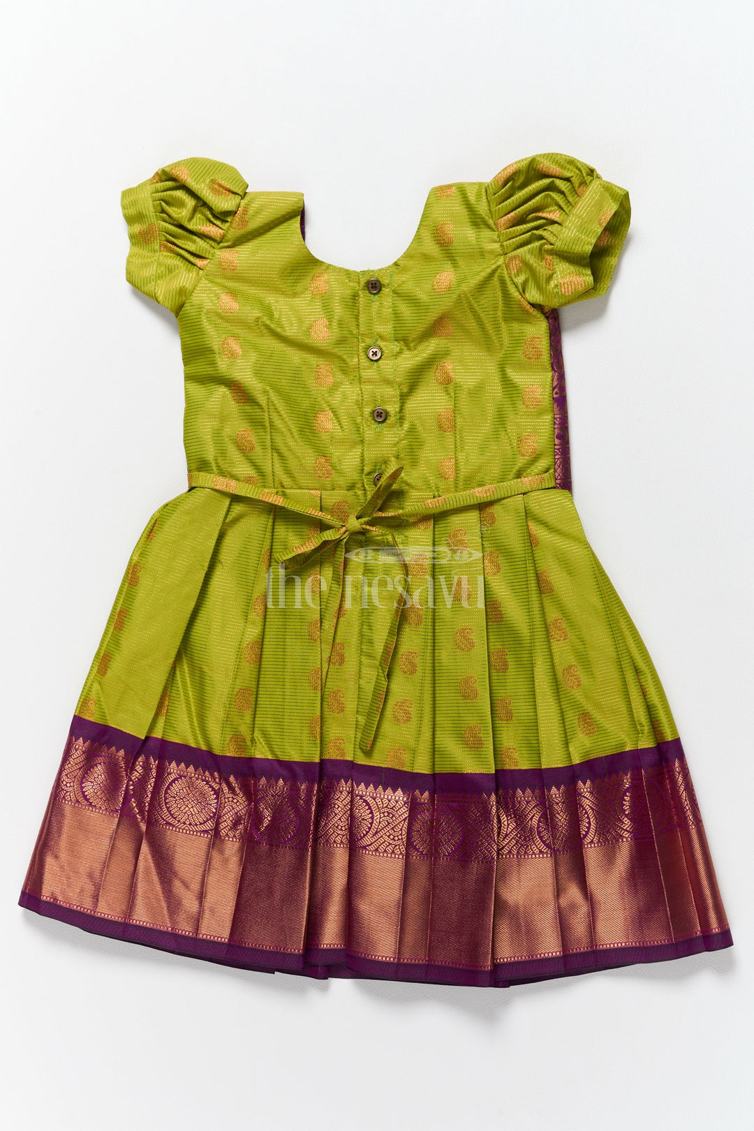 The Nesavu Girls Kanchi Silk Frock Elegant Girls Kanchi Silk Frock with Intricate Purple Border for Pongal Dressing Nesavu Pongal Special Girls Kanchi Silk Frock Lime Green Purple Design Nesavu