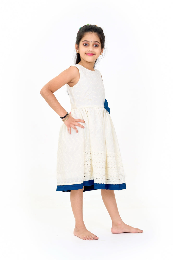 The Nesavu Girls Cotton Frock Elegant Girls White Hakoba Cotton Frock with Contrasting Bow and Delicate Detailing Nesavu Girls White Hakoba Cotton Frock Contrasting Bow Elegant Embroidery | The Nesavu