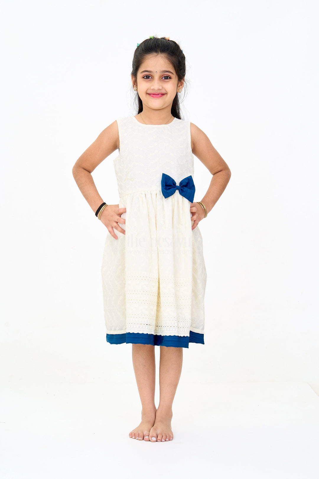 The Nesavu Girls Cotton Frock Elegant Girls White Hakoba Cotton Frock with Contrasting Bow and Delicate Detailing Nesavu Girls White Hakoba Cotton Frock Contrasting Bow Elegant Embroidery | The Nesavu