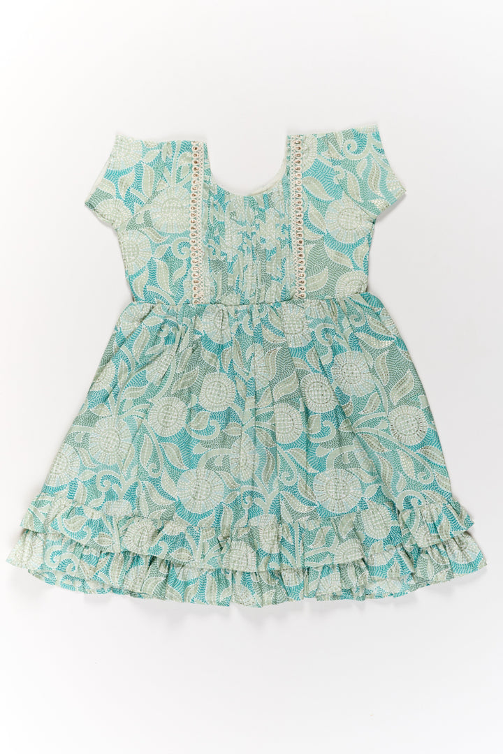 The Nesavu Girls Cotton Frock Elegant Green Cotton Designer Frock for Girls with Floral Prints and Frill Details Nesavu Elegant Green Cotton Designer Frock Girls Floral Prints Frill Details | The Nesavu
