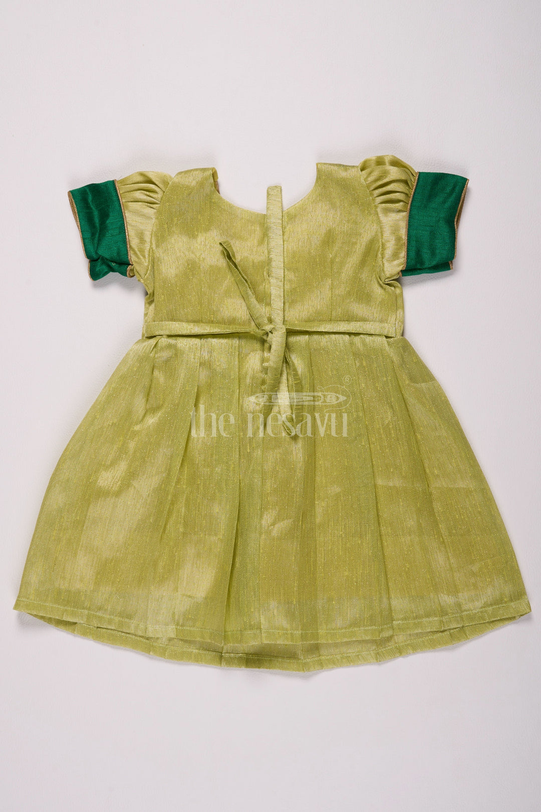 The Nesavu Silk Frock Elegant Light Green Frock Pattu for Girls with Silver Tissue and Golden Yoke Nesavu Nesavus Light Green Frock Pattu Girls Silver Tissue Festive Golden Detailing