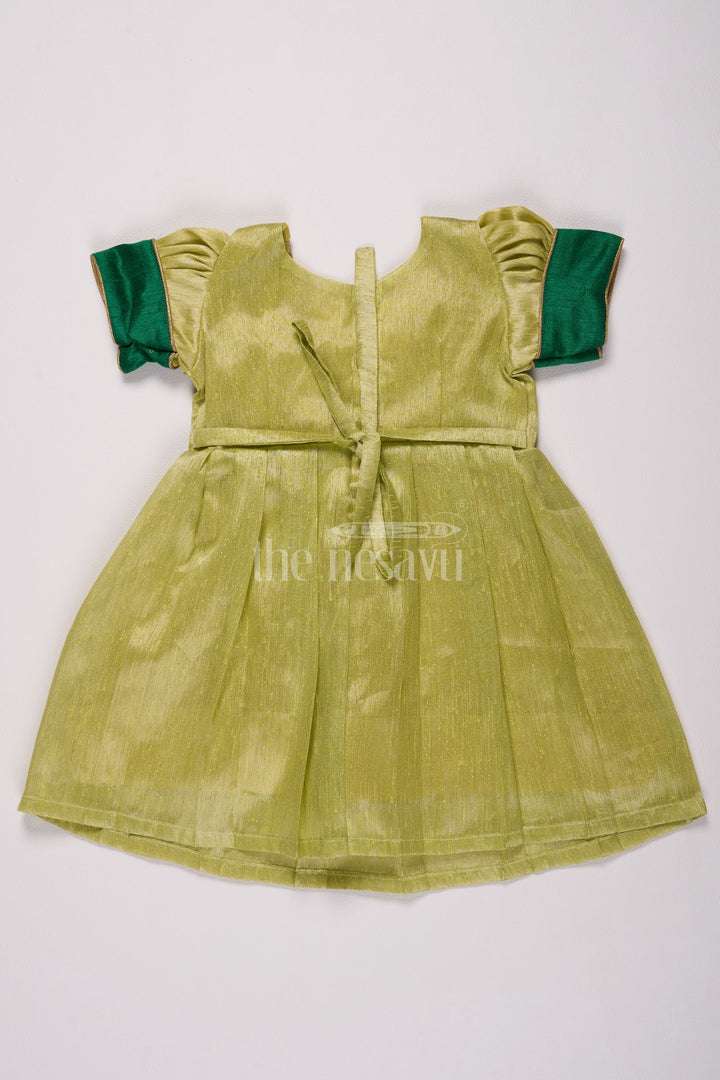 The Nesavu Silk Frock Elegant Light Green Frock Pattu for Girls with Silver Tissue and Golden Yoke Nesavu Nesavus Light Green Frock Pattu Girls Silver Tissue Festive Golden Detailing