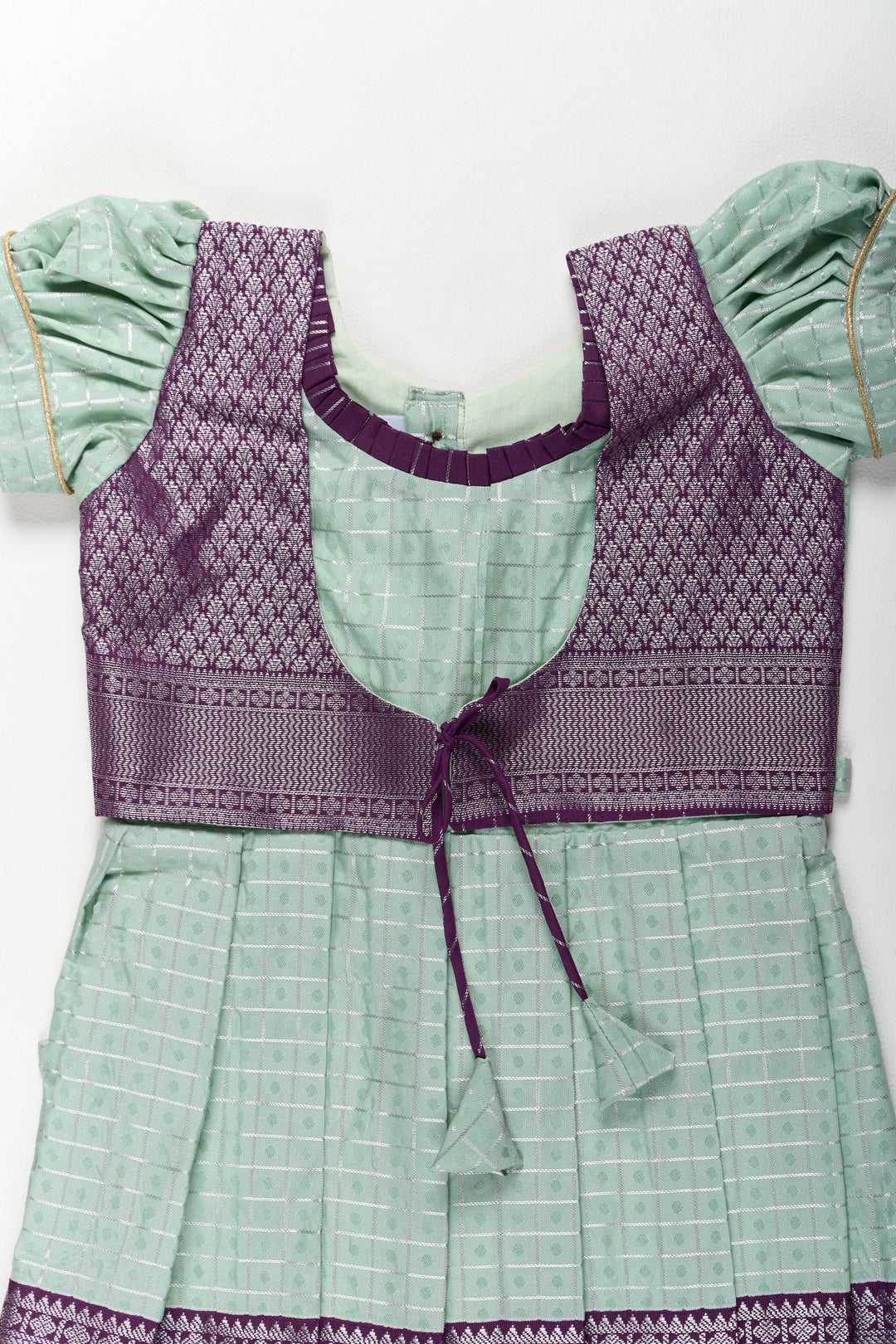 The Nesavu Girls Kanchi Silk Frock Elegant Sea Green and Purple Pattu Pavadai for Girls with Rich Zari Borders Nesavu Elegant Sea Green Purple Pattu Pavadai Girls Rich Zari Borders | The Nesavu