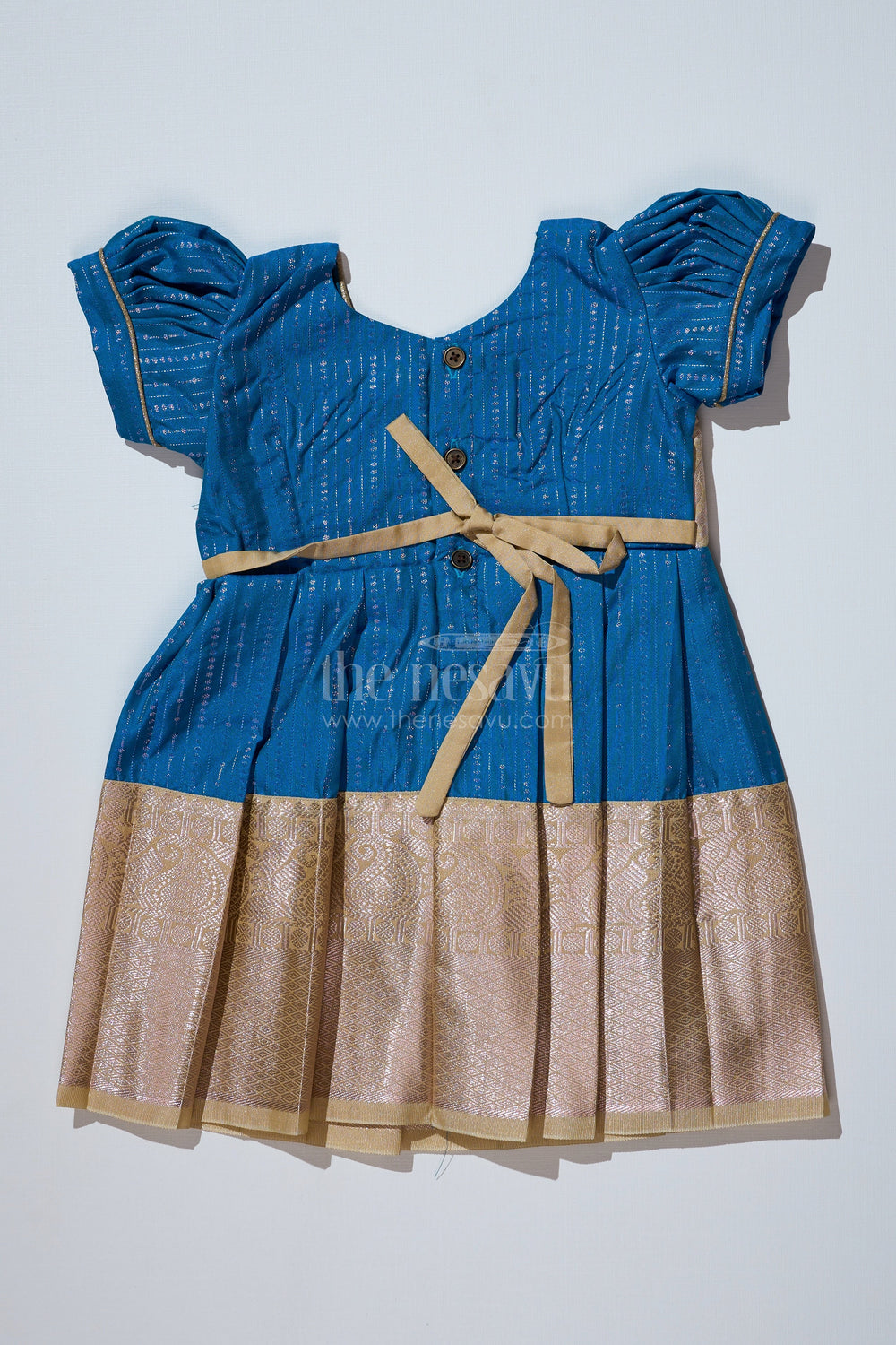 The Nesavu Girls Kanchi Silk Frock Elegant Teal Silk Dress for Girls with Kanchipuram Inspired Fabric and Gold Zari Pleated Border Nesavu Nesavu Teal Silk Dress Girls Kanchipuram Inspired Fabric Gold Zari Pleated Border