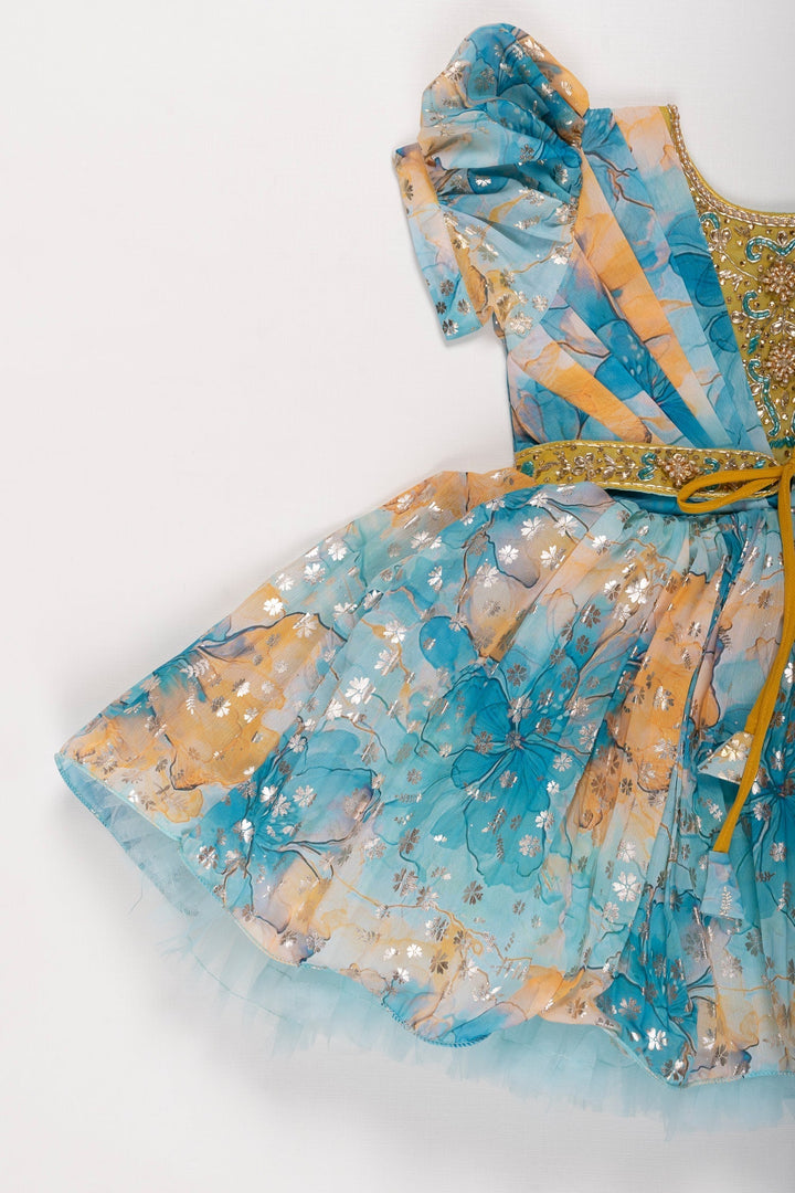 The Nesavu Silk Party Frock Enchanted Garden Silk Party Frock in Blue and Yellow Nesavu Blue & Yellow Floral Silk Frock for Girls | Stone Embroidered Party Dress | The Nesavu