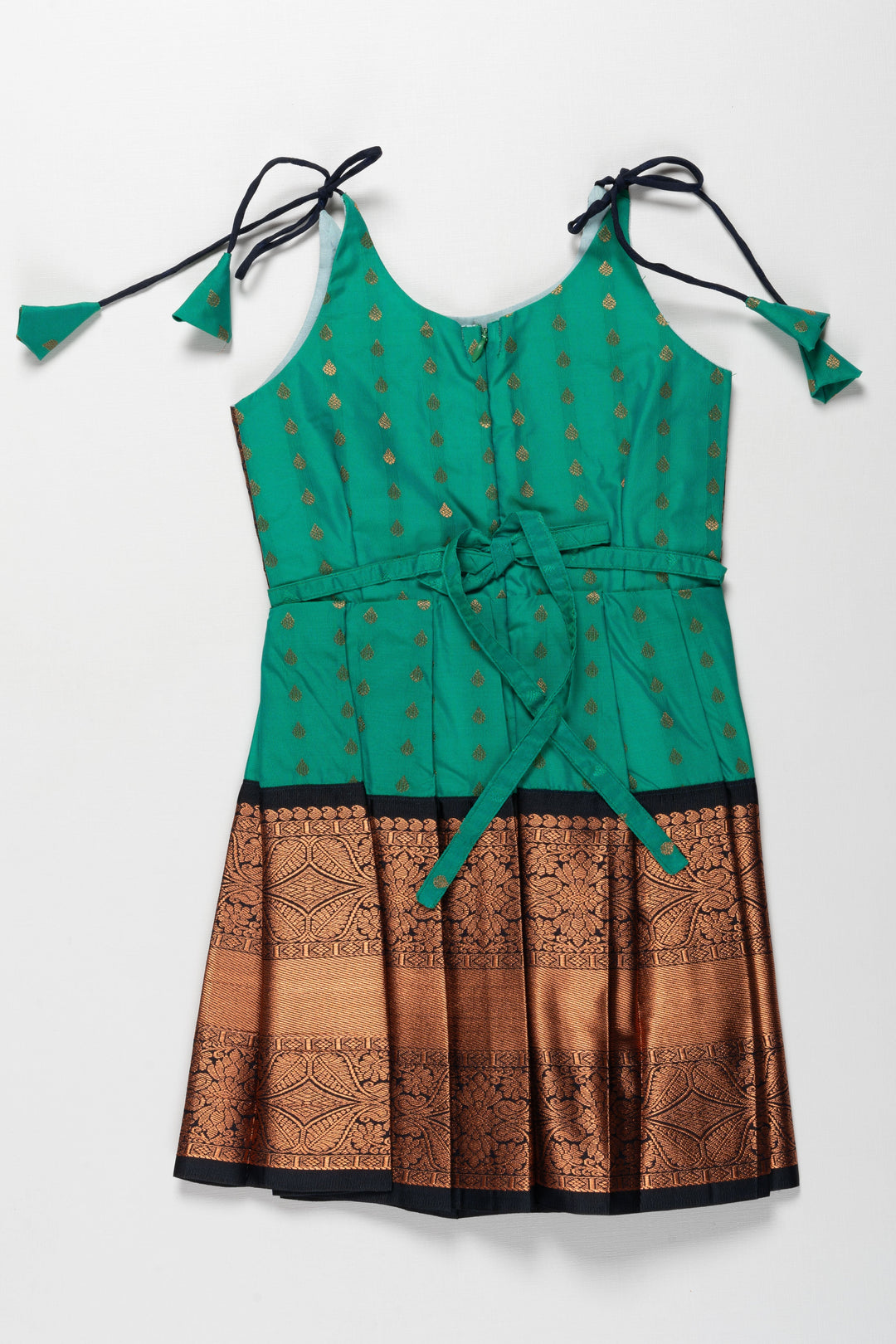 The Nesavu Tie-up Frock Enchanting Green and Bronze Silk Knot-Tie Frock for Ayush Homam and Noolukettu: A Blend of Tradition Nesavu Chic Green and Bronze Silk Dresses for Girls | Elegant Party Wear with KnotTie Detail | The Nesavu